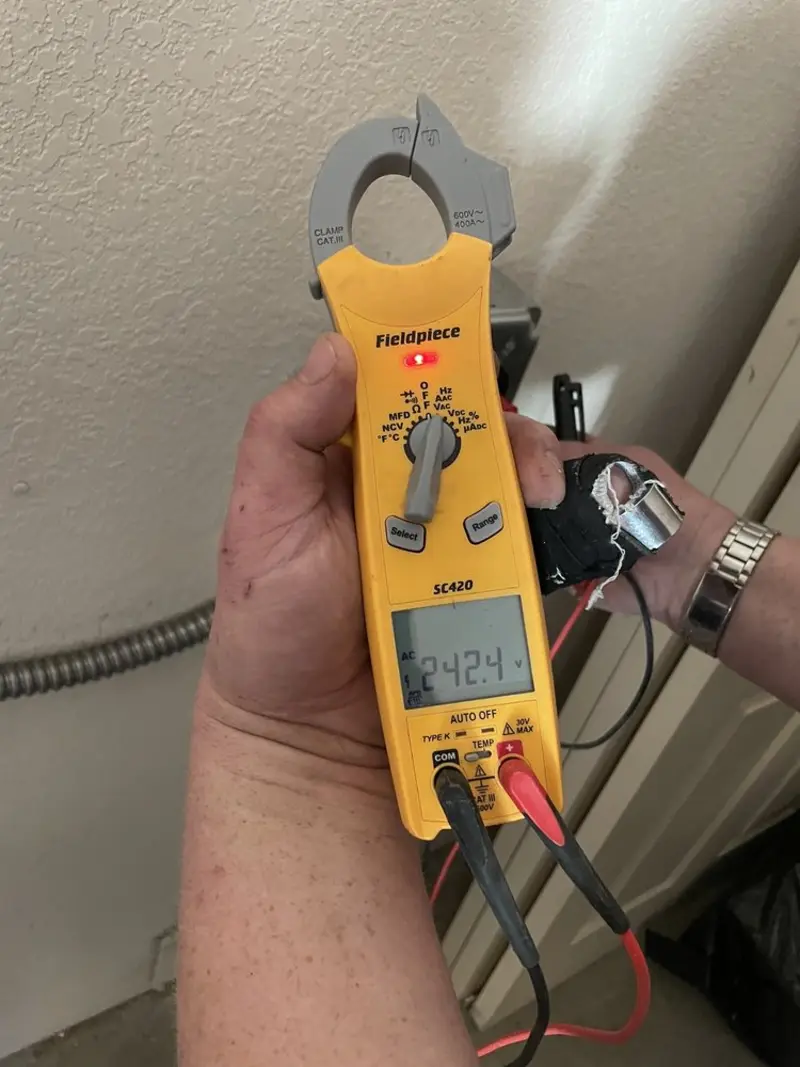 Voltage testing with clamp meter during Generator Installation in Itasca